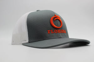 The Ridge Trucker Charcoal/White Orange logo