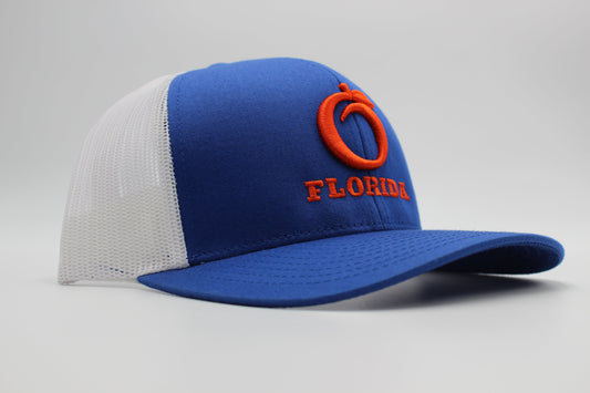 The Ridge Trucker Royal/White Orange logo