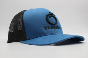 The Ridge Trucker Ocean Blue/Charcoal Pewter logo