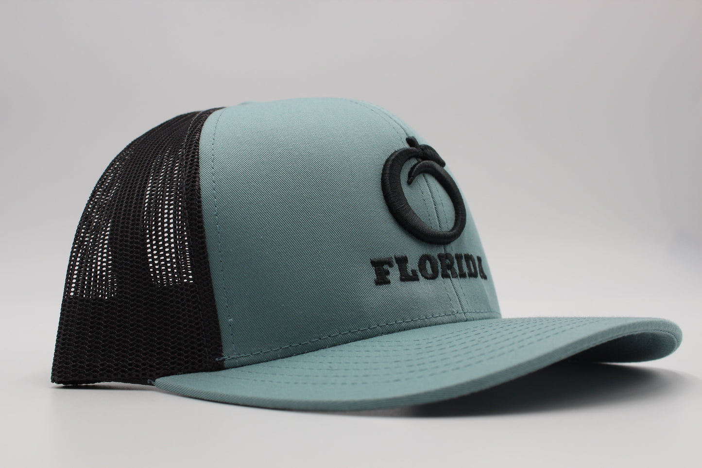 The Ridge Trucker Smoke Blue/Charcoal Pewter logo
