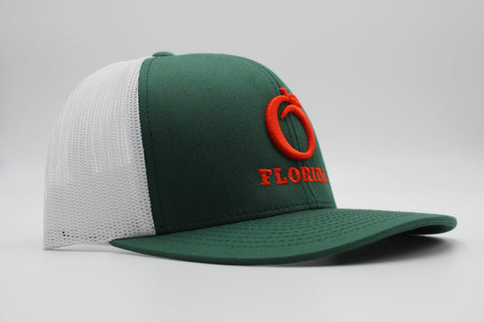 The Ridge Trucker Dark Green/White Orange logo
